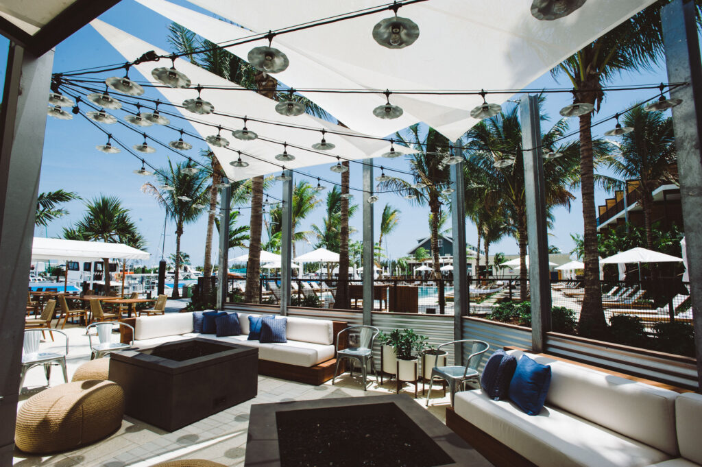 Poolside lounge area with canopy and seating.