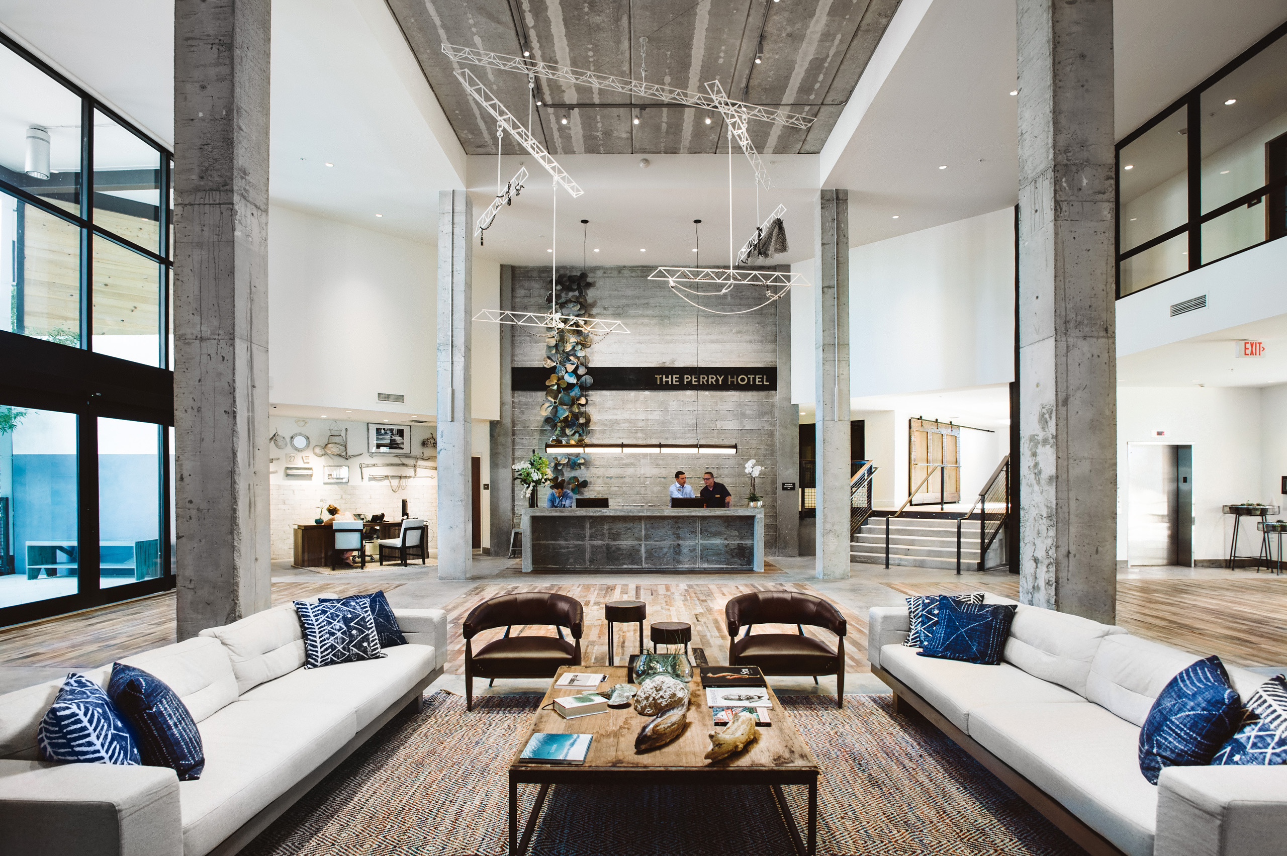 Hotel lobby with front desk and seating area.