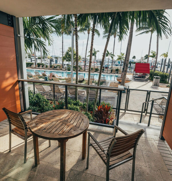 Lanai patio with table and chairs overlooking the pool.