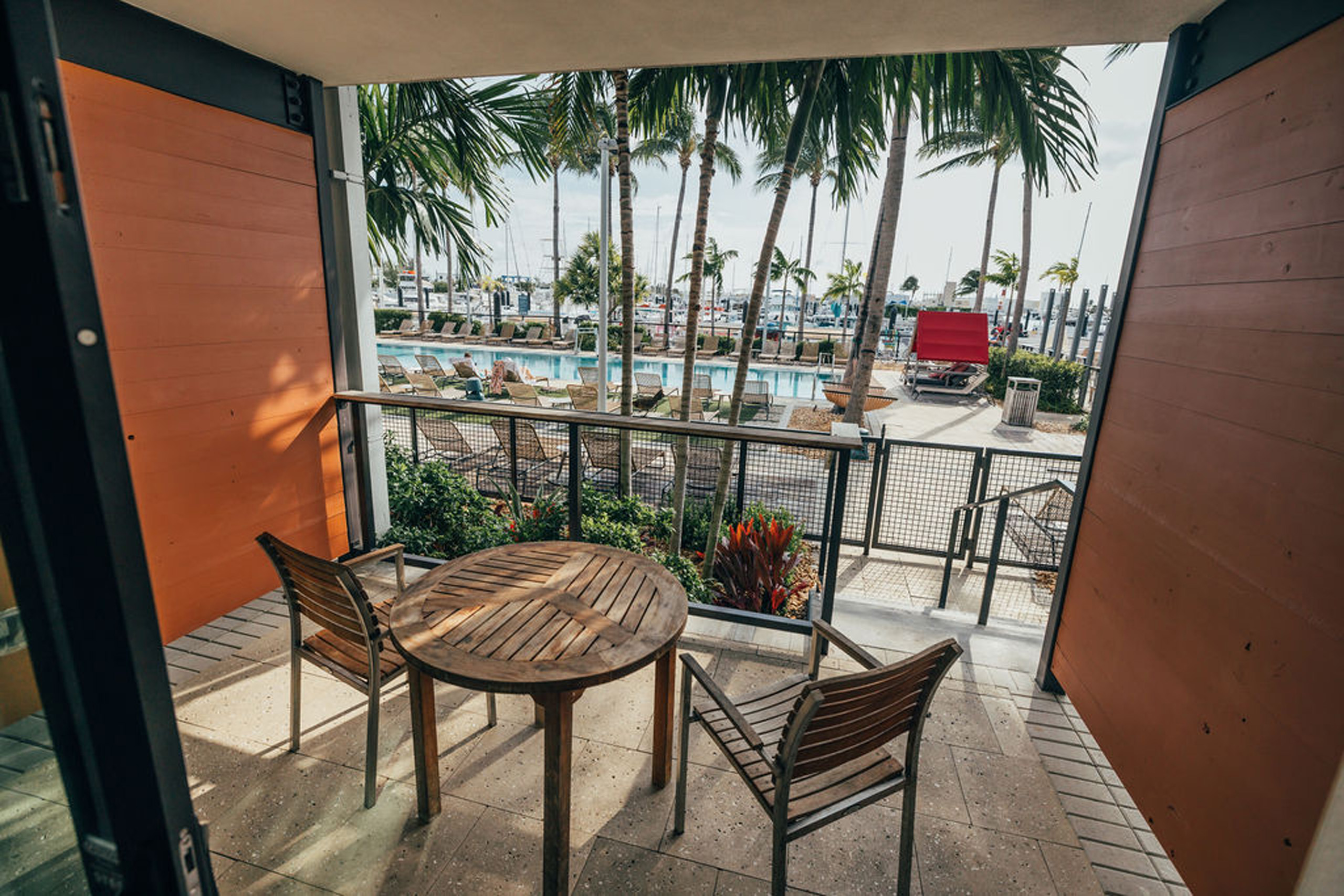 Lanai patio with table and chairs overlooking the pool.