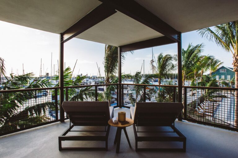 Grand Suite Patio with two lounge chairs overlooking the Marina