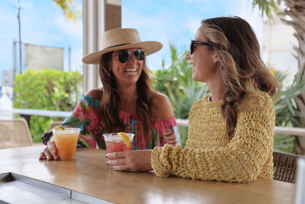 Women enjoying drinks at Salty Oyster at The Perry